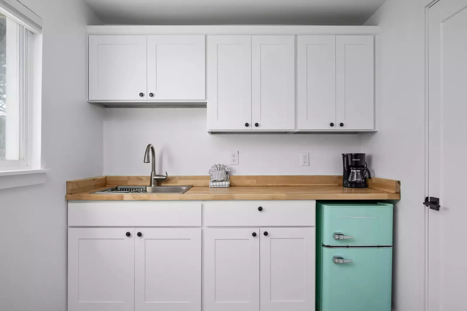 Enjoy a nice meal in the kitchenette area equipped with a mini-fridge, coffee maker, and microwave.