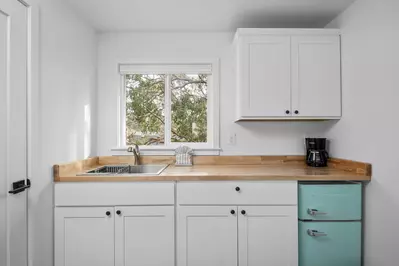 Enjoy a nice meal in the kitchenette area equipped with a mini-fridge, coffee maker, and microwave.