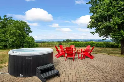 The hot tub is a favorite amenity perfect during warm summers and chilly winters.  It has a great view of the countryside.