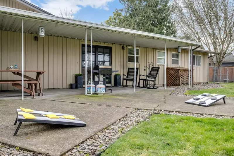 Play a game of corn hole as another member of your group grills on the BBQ.