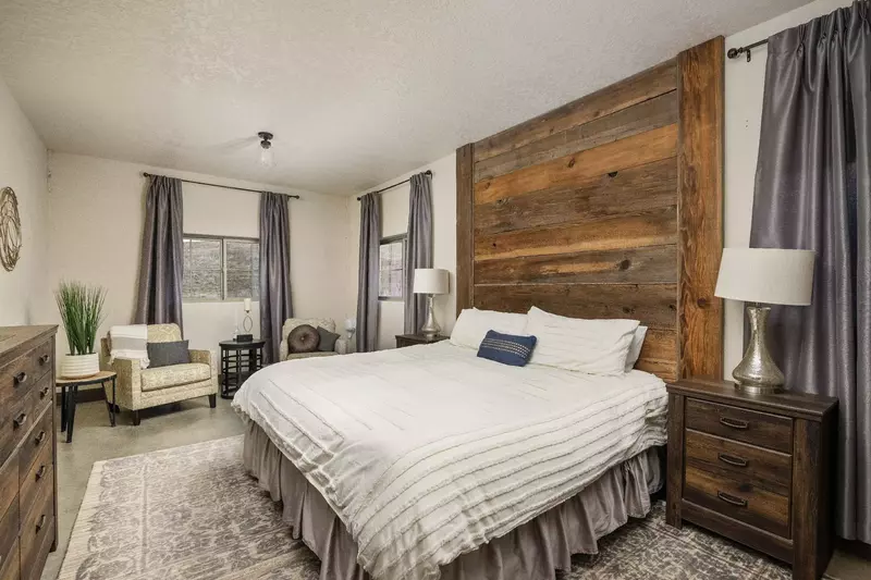 This converted tasting room boasts a primary bedroom that is perfect for any person or couple.