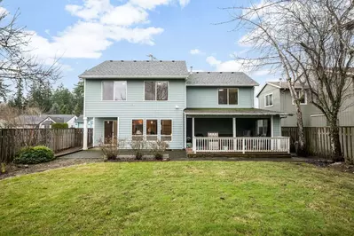 The backyard is spacious and a great place for a picnic.