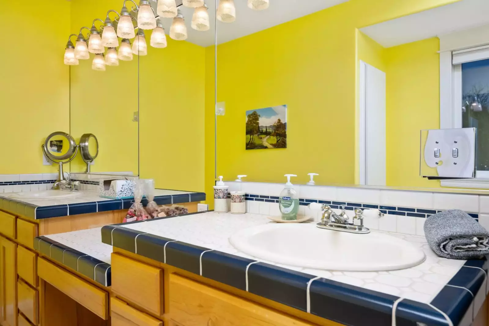 This bathroom has two sinks and a shower with excellent water pressure.