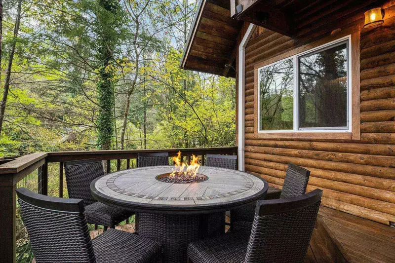 The fire table is another spot to enjoy a lovely forest night.
