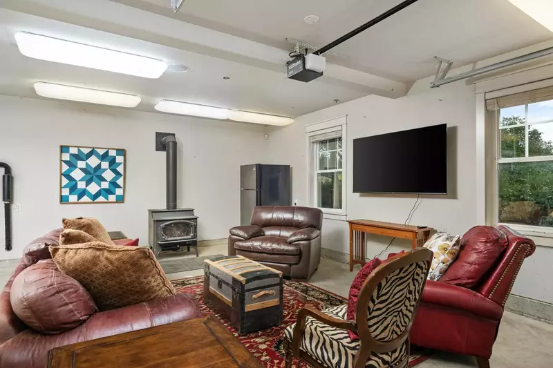 A great place to hangout with a stove fireplace, smart tv, extra fridge, and more!