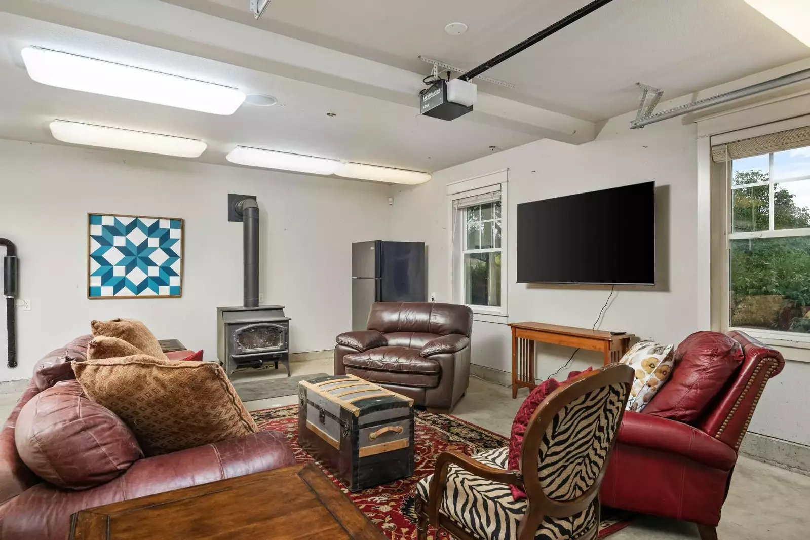 A great place to hangout with a stove fireplace, smart tv, extra fridge, and more!