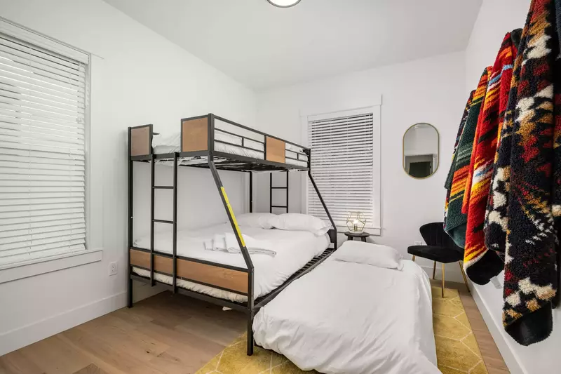 Twin over full bunk bed w/ additional attached twin trundle.