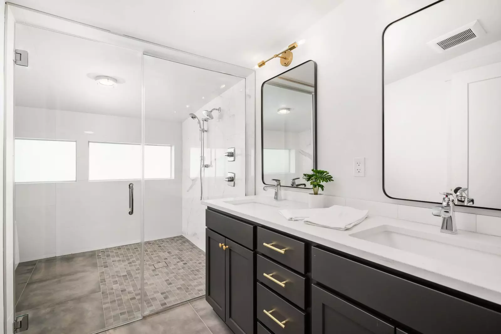 Primary bathroom includes two sinks, a soaking tub, and an enormous shower that will make every morning start off wonderfully.