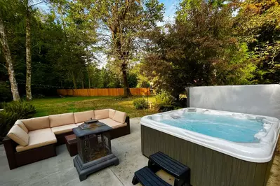 The hot tub is a favorite amenity perfect during warm summers and enchanting winters.