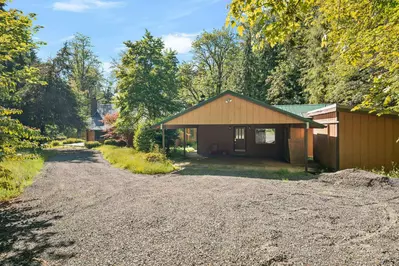 The Fernwood guest cabin and main house at arrival.