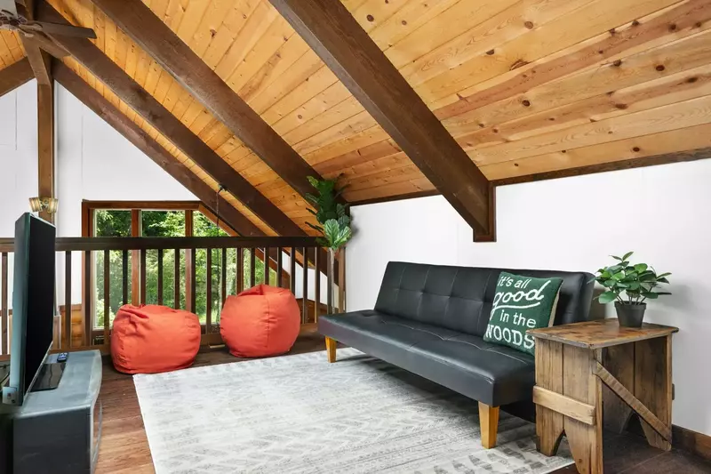 Another smart tv and cozy couch.