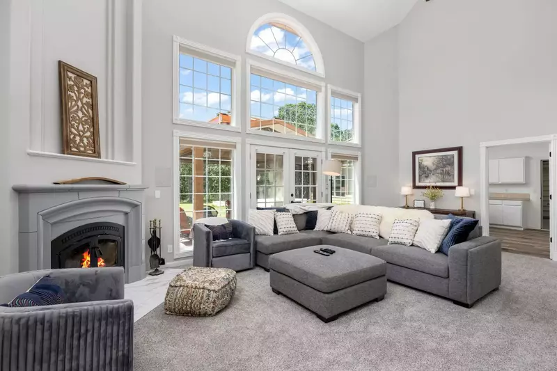 The main living and kitchen area is adorned with vaulted ceilings and the windows to match.