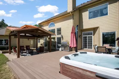 Just outside is an epic setup with plush seating, fire-pit, incredible views, and hot tub that can overlook it all.