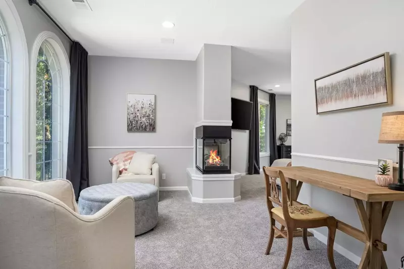 A cozy area with a warm fireplace.