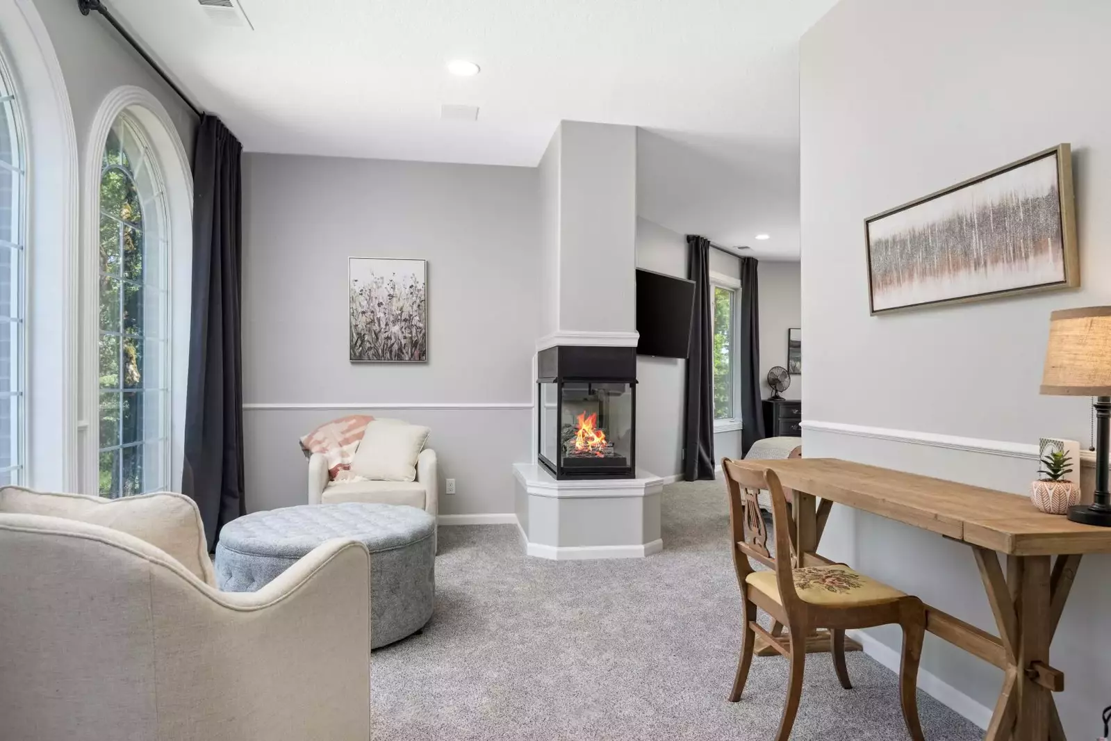 A cozy area with a warm fireplace.