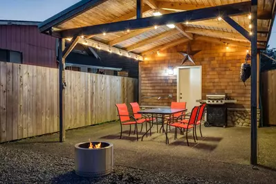 The outside area is a perfect place to spend time with friends and family. Enjoy the covered seats, propane bbq, and fire pit.