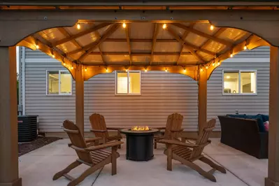 In the patio area guests can relax in front of the fire pit.