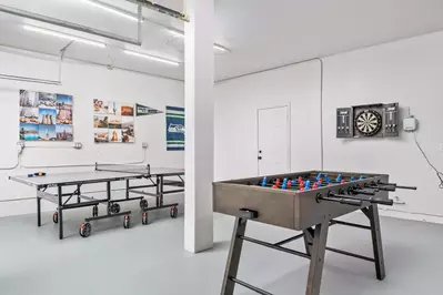 The game room is full of activities like ping pong, foosball, darts, and more!