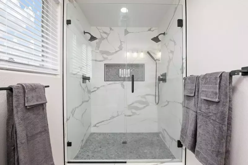 The shower is spacious, up to date, has excellent water pressure, and multiple shower heads.