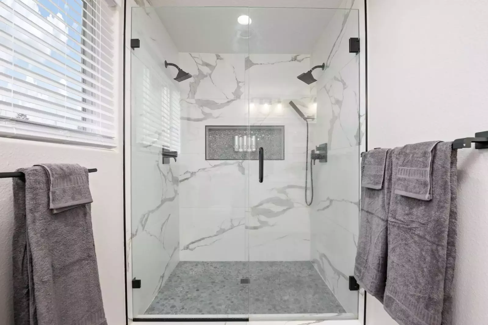 The shower is spacious, up to date, has excellent water pressure, and multiple shower heads.