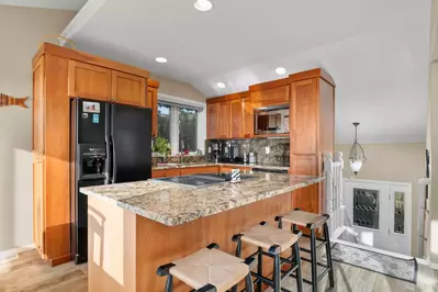 Countless renovations including a beautiful new kitchen, granite counter tops & plank floor tile.