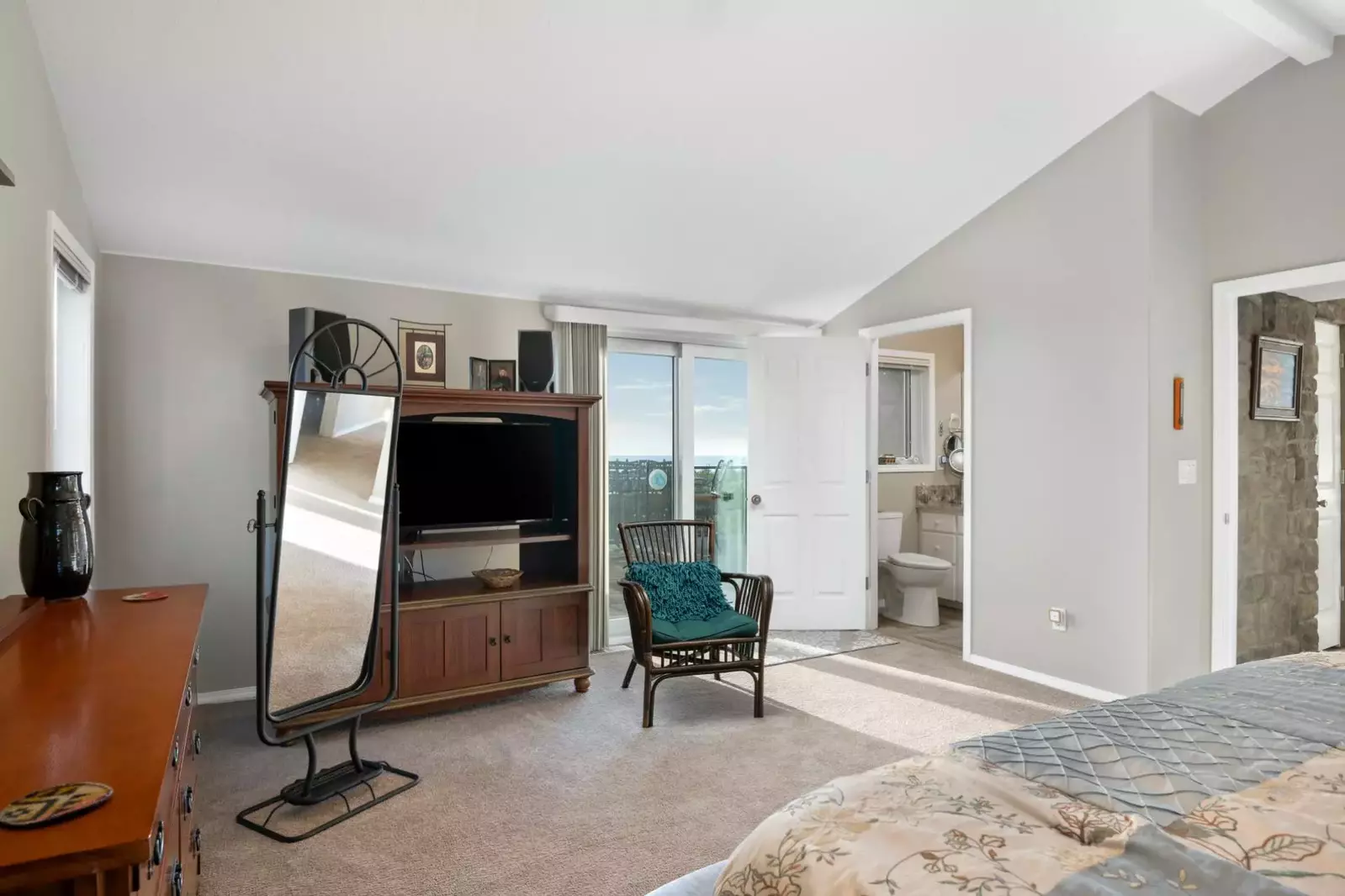 This bedroom has an en suite bathroom, lots of space, and a great view!