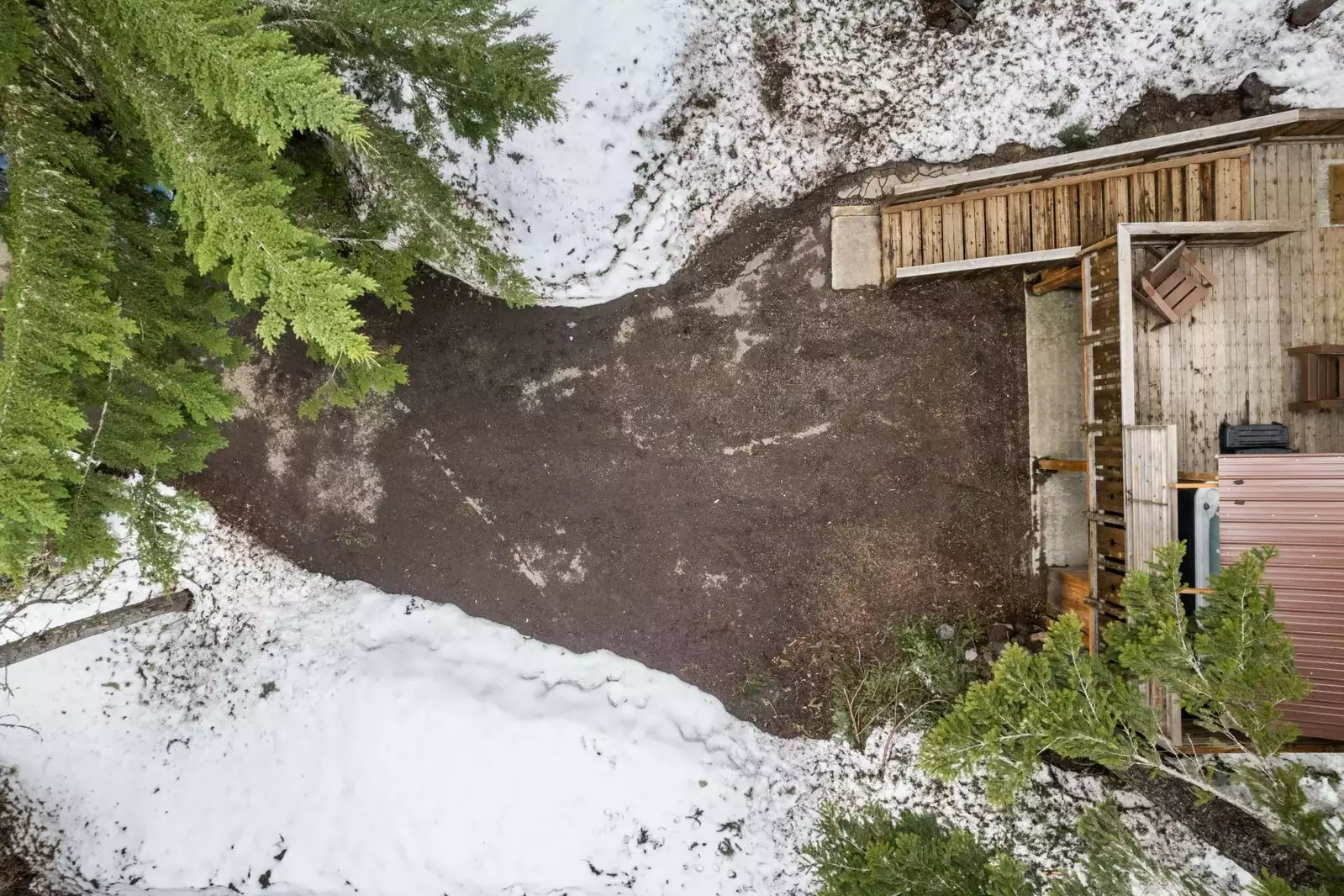 The driveway and road are plowed during winter.