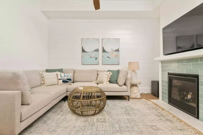 Another comfy area with a smart tv and a cozy fireplace.