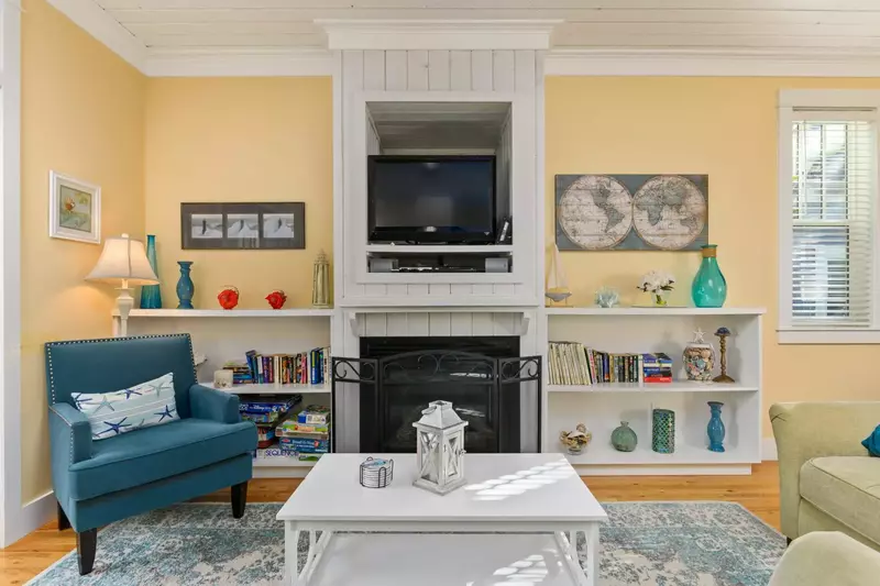 The cozy living room with fireplace in the center was just right for relaxing.  -Jeff Greer H.