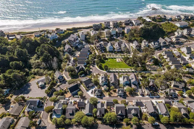 Olivia Beach is a cozy neighborhood with a community park, a volleyball court, a seasonal pool, a playground, and easy beach access.