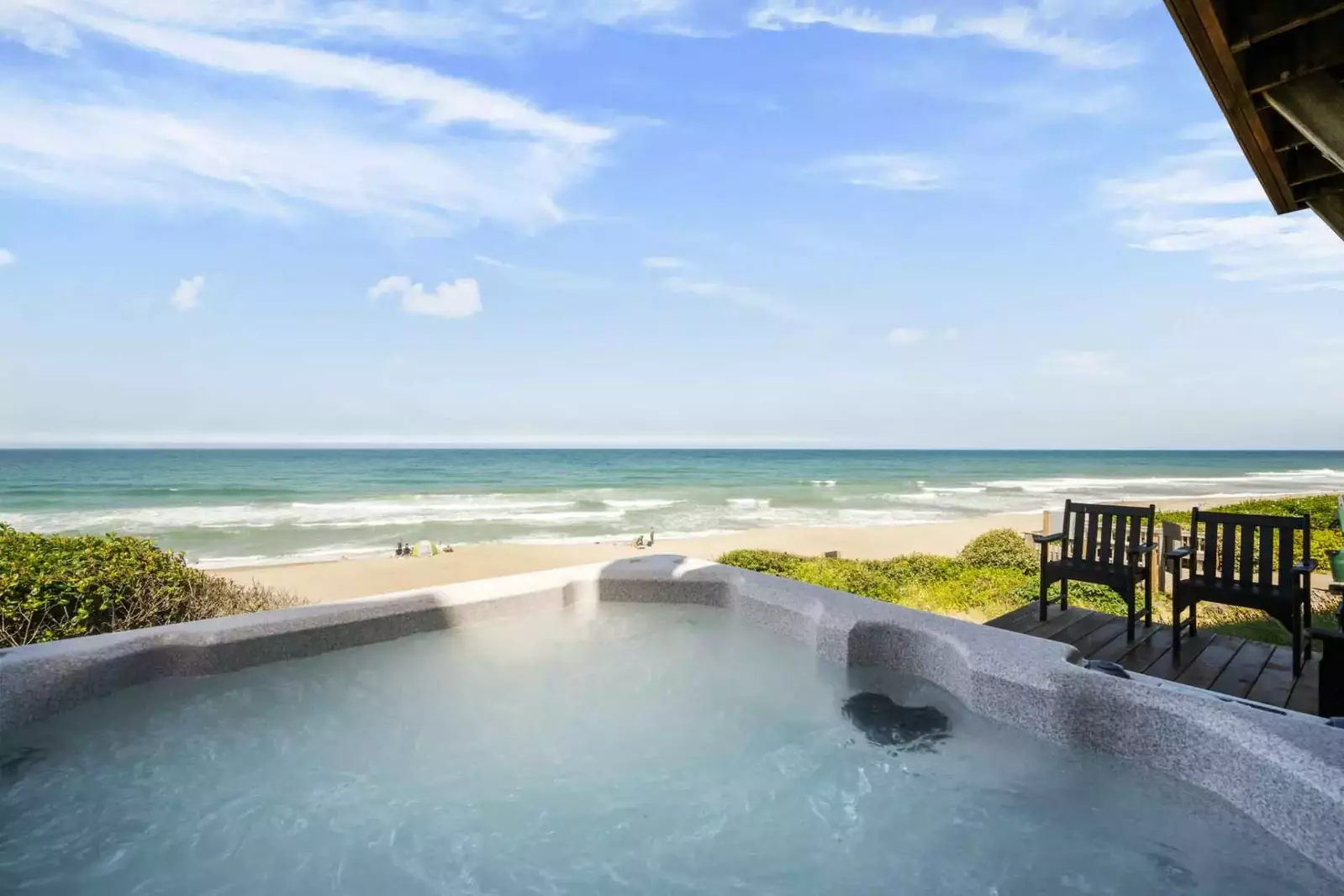 Relax in the hot tub as you watch the waves crash and the sunset.