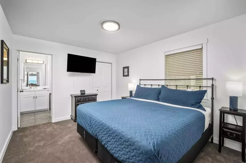 Enjoy the tv as relaxing in this king sized bed.