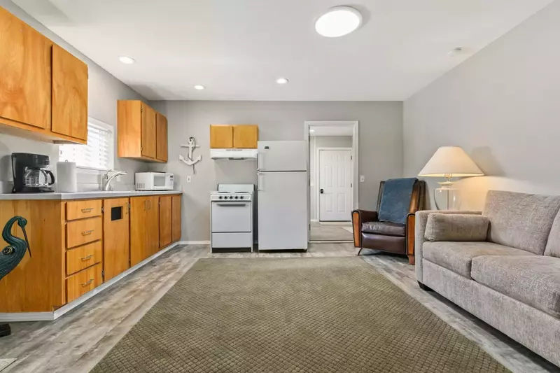 Kitchenette style space and casual seating area in detached dwelling unit.