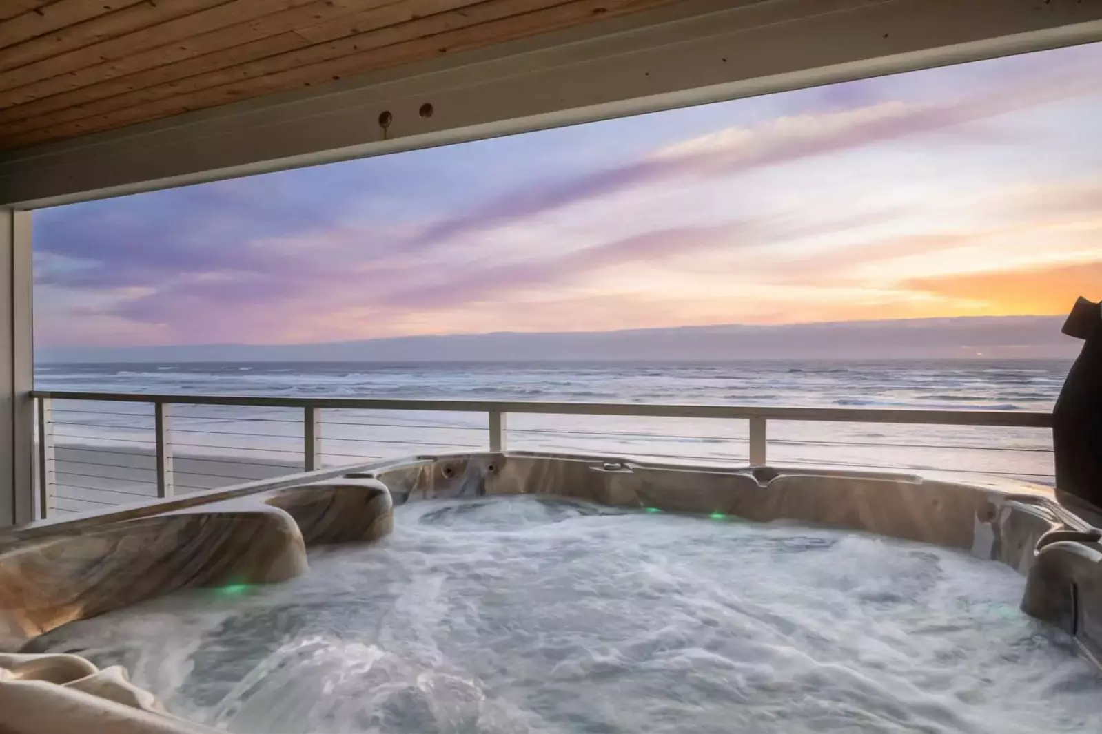 The hot tub is an excellent place to warm up while watching an Oregon Coast sunset.