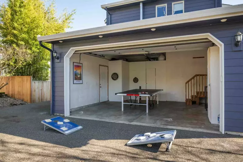 The garage has been converted into a game room.