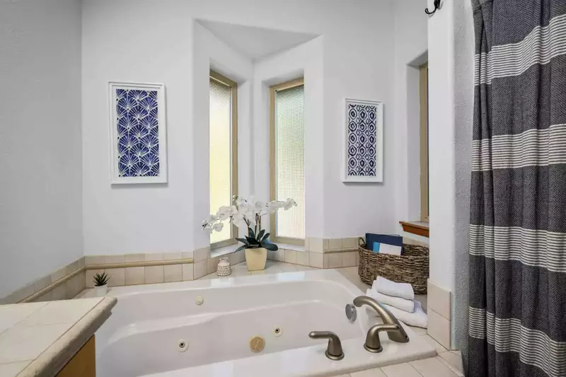 This bath tub is a jacuzzi tub.