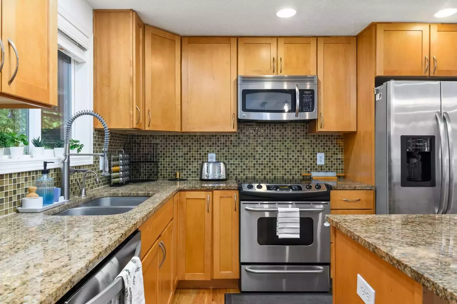 The kitchen boasts plenty of counter space and is fully stocked.