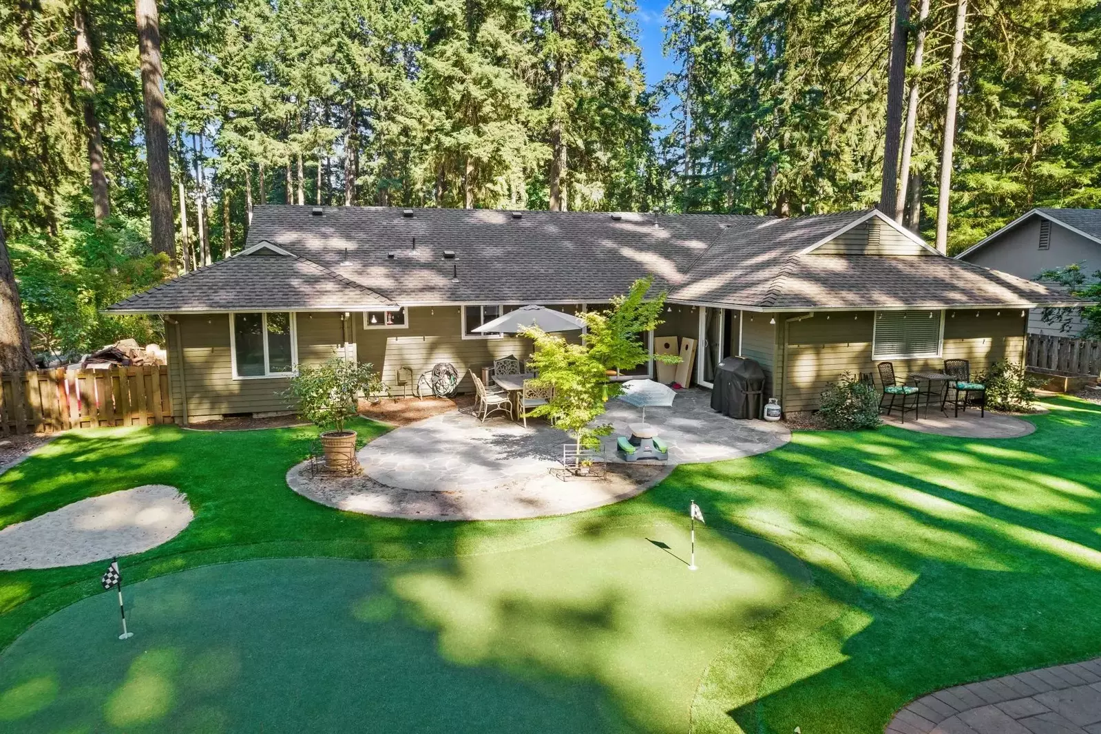 Incredible indoor / outdoor living with faux grass golf experience, gazebo, fire-pit, and tons of outdoor seating.