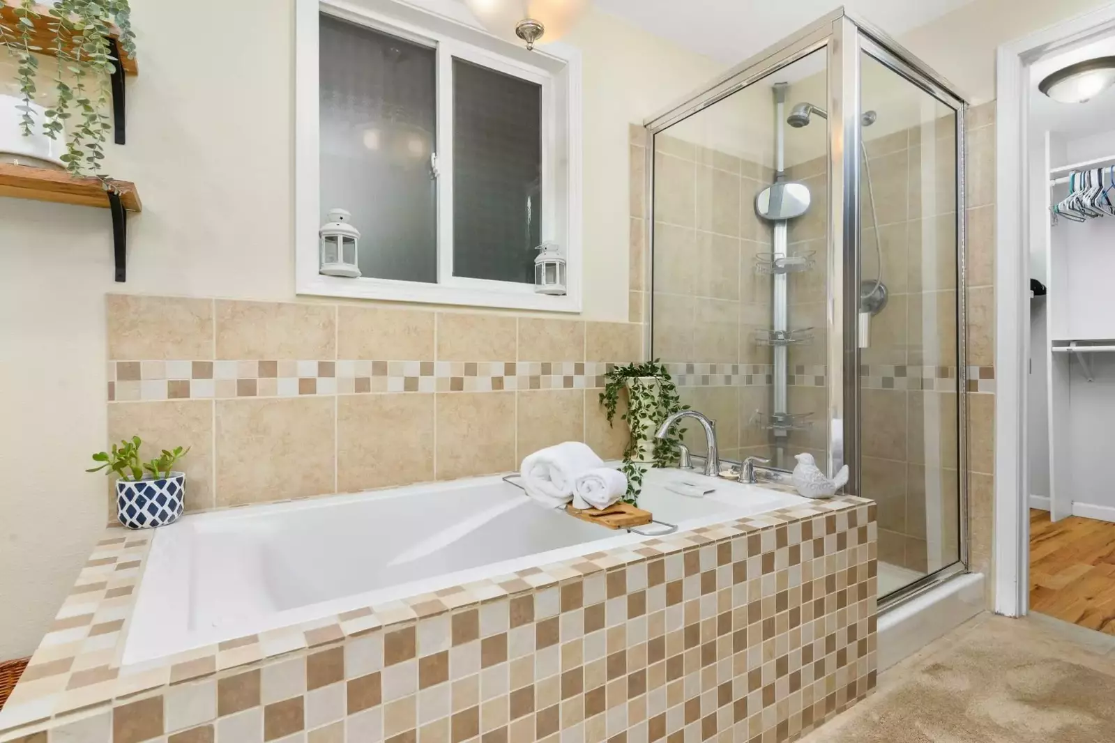 The primary bathroom has a wonderful tub for soaking as well as a standup shower to enjoy.