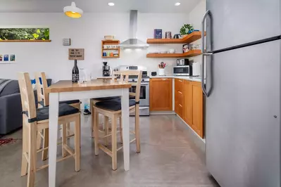 The kitchen is well stocked and the living area is very comfortable.  -Barbara