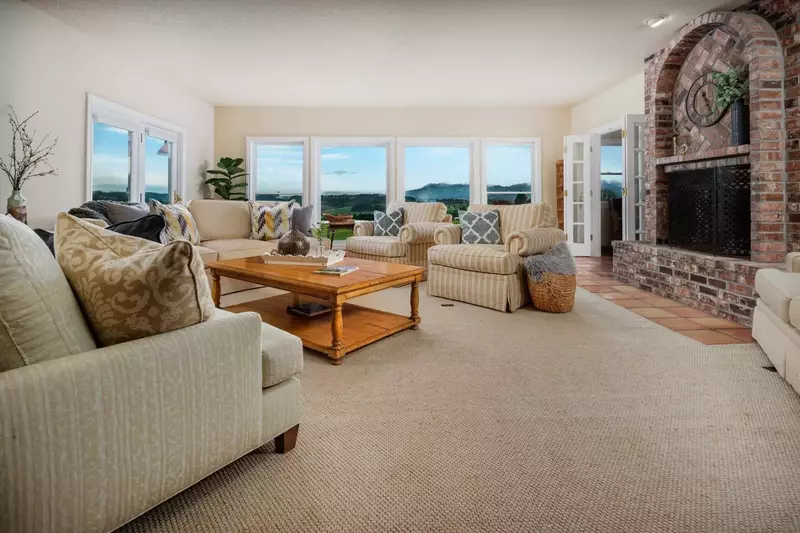 Breathtaking views in the lower level living room just off of the kitchen and deck.