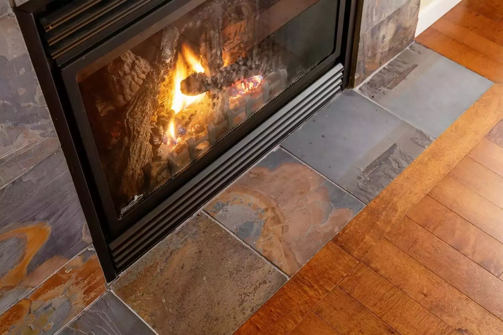 Relax in the living room in front of a cozy fire.