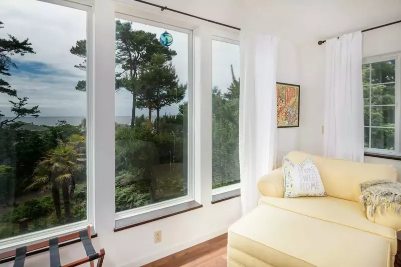 Master Bedroom Seating Area With Ocean and Forest View.
