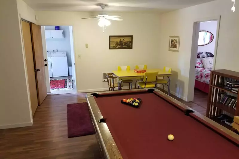 Pool Table And Game Room Connected To Two Bedrooms and Laundry.