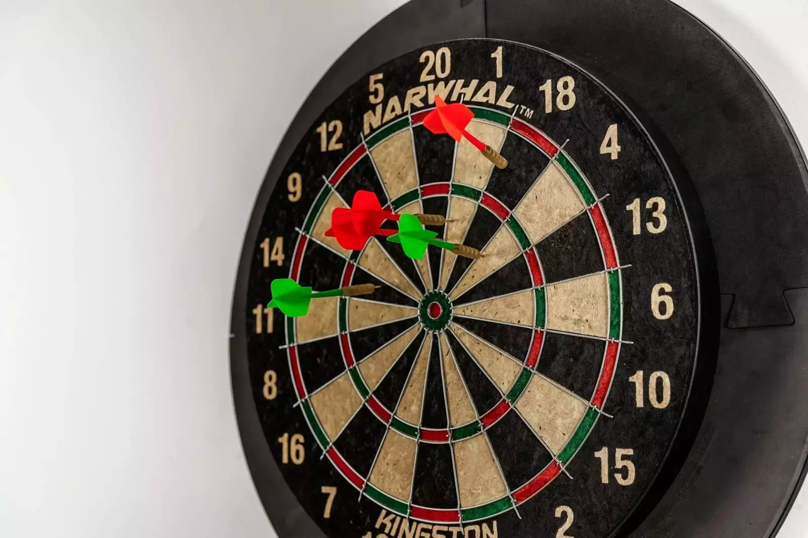 A dart board with darts for guest enjoyment.