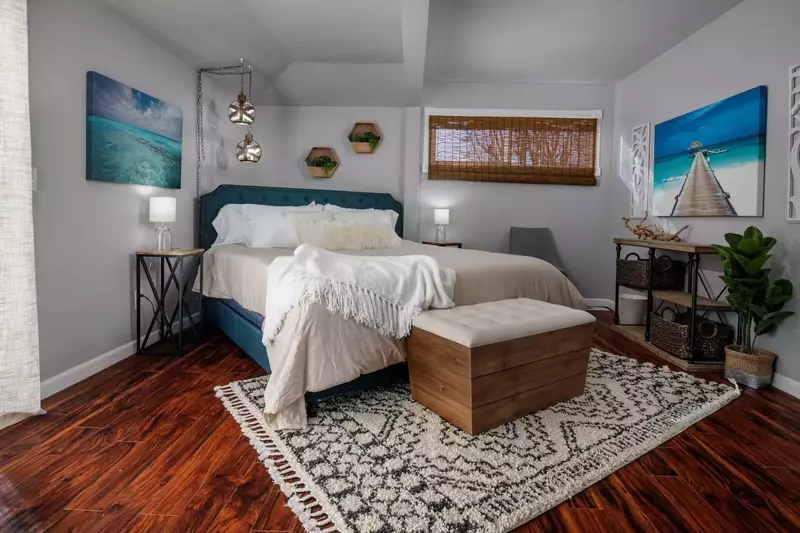 Spacious master bedroom with king bed that leads out to the back deck.