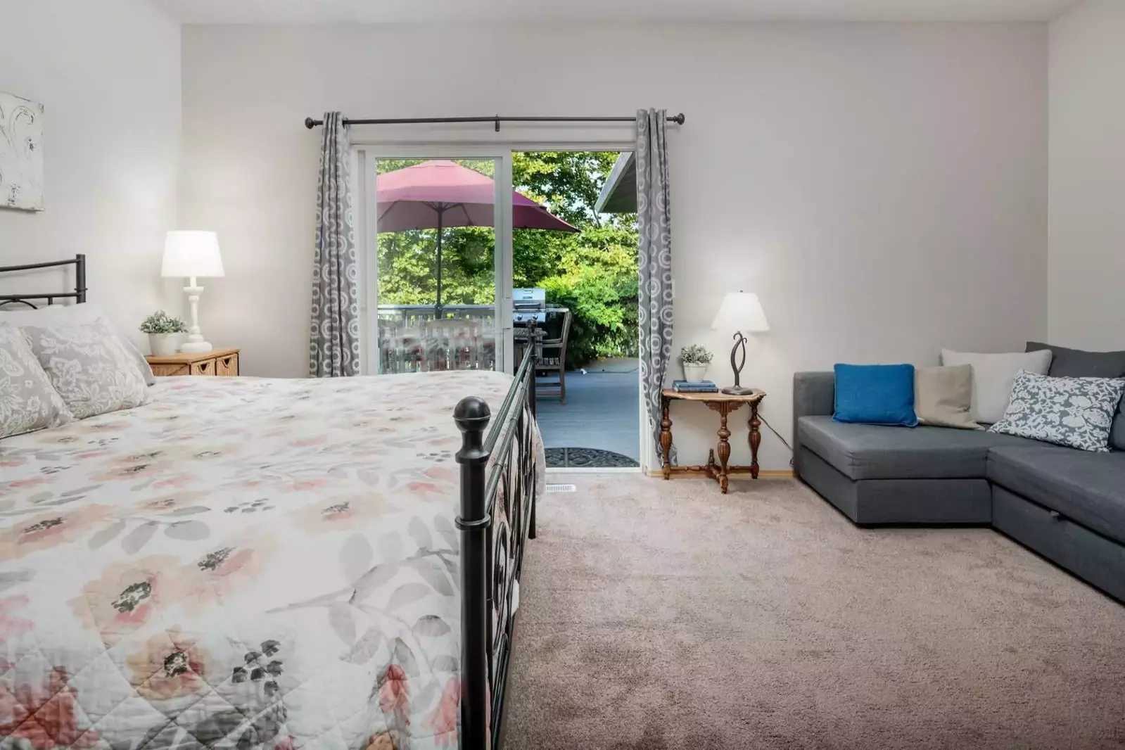 Enjoy the natural light and deck with greenery just off the master bedroom