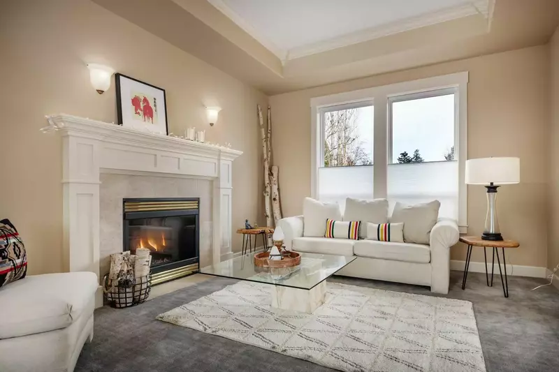 Relax in the living room in front of a cozy fire.