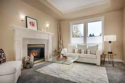 Relax in the living room in front of a cozy fire.