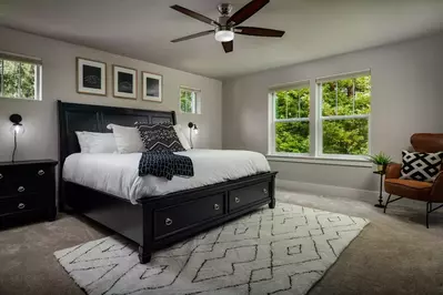 The master bedroom had a very comfortable king bed and was completely private with windows overlooking the trees.  -Cynthia